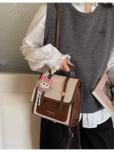 Retro contrast color student backpack in off-white and brown with cute plush charm