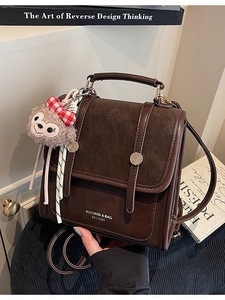 Retro contrast color student backpack in dark brown faux leather with rabbit charm
