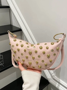 Pink crescent shoulder bag with golden rivets and metallic eyelet rock style decoration