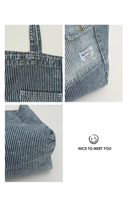 Detailed views of striped canvas tote bag showing reinforced handles and pocket stitching