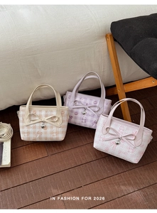 Close-up of macaron color tote bags with bear prints and bow details for 2026 fashion