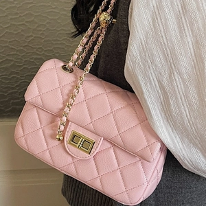 Elegant pink quilted crossbody chain bag for women with gold clasp closure and leather strap