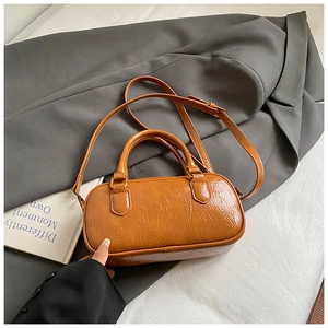 Caramel brown wrinkled patent leather Boston bag with handles and adjustable shoulder strap