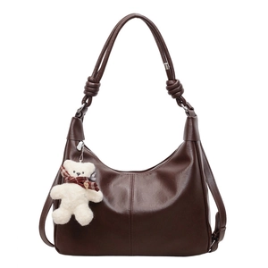 Vintage dark brown large tote bag with shoulder strap and cute plush bear accessory