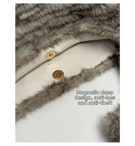 Detail of grey leopard faux fur tote featuring a secure gold magnetic closure and lining