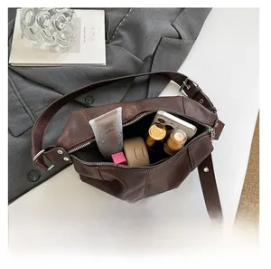 Deep brown lychee grain leather shoulder bag interior showing daily storage capacity