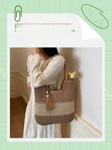 Detail of hand-woven tri-color beach tote bag with fringe wood bead tassels and shoulder straps