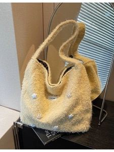 Large beige faux shearling tote bag with star patch and soft teddy fleece texture