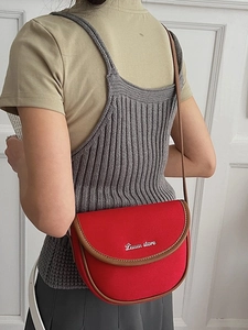Retro red canvas saddle bag with brown leather trim and thin shoulder strap