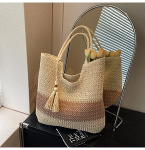 Detail of the wave-patterned woven texture and gradient straw layers on the tote bag