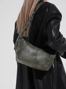 Retro dark green shoulder bag with textured faux leather and adjustable strap details