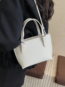 Minimalist cream white lychee leather bucket bag with silver buckles for women