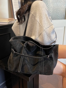 Retro black tote bag with white contrast stitching and buckle detail for women