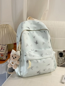 Mint green school backpack with realistic butterfly print and plush bear keychain decoration