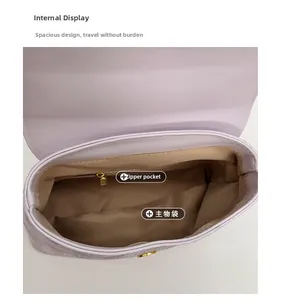 Internal view of the square bag featuring a main pocket and an inner zipper compartment
