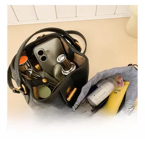 Top view of black lychee grain bucket bag showing spacious interior with drawstring liner