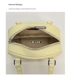 Top view of the yellow Boston bag showing spacious interior with a zippered pocket
