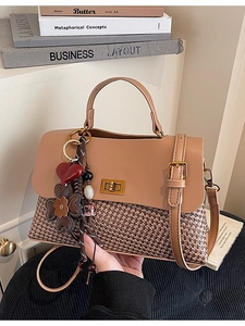 Caramel leather and tweed patchwork handbag with gold clasp and decorative pendant