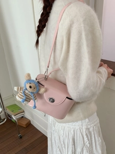 Pink leather crossbody box bag with cute knitted bear charm on handle for women