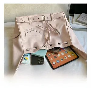 Large capacity punk style rivet tote bag showing storage for tablet, phone and wallet