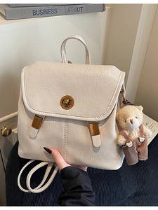 Cream vintage faux leather backpack with gold twist lock and cute plush bear keychain