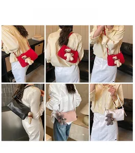 Chic pillow bag styles in red black pink and white shown with cute bear charm accents