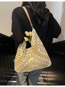 Large beige woven crochet tote bag with hollow diamond pattern and brown leather strap