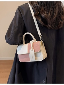 Fashionable two-tone crossbody square bag with cream and pink paneling and hand strap