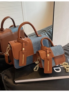 Chic brown leather and blue denim patchwork crossbody bag with elegant chain strap