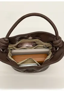 Top view of bucket bag interior showing spacious compartments and functional pockets