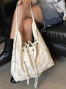 Retro punk off-white tote bag with silver metal rivets and stylish drawstring closure