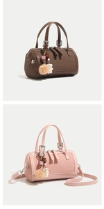 Detail of woven Boston bags in dark brown and pink with plush bear charms and handles