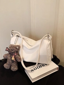 White lychee texture half-moon shoulder bag with cute brown teddy bear charm