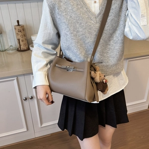 Classic taupe pebble leather shoulder bag with silver turn-lock and teddy bear charm