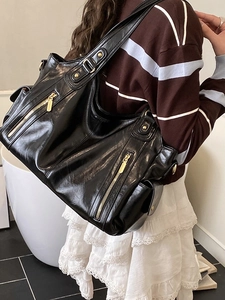 Retro black high-capacity tote bag in glossy PU leather with gold zippers and rivets