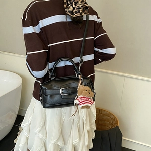 Chic black leather Boston bag with silver buckle and cute teddy bear charm for women