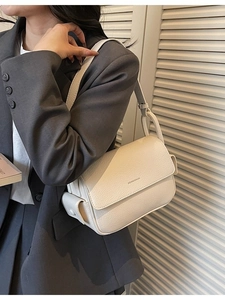 Minimalist beige lychee grain leather crossbody bag for women with shoulder strap