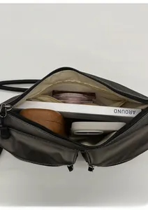 Interior view showing the large storage capacity of this grey nylon crossbody shoulder bag