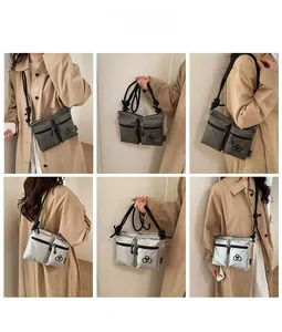 Detail of waterproof nylon crossbody bag with dual front pockets and adjustable rope strap