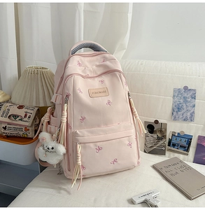 Zaino scolastico rosa con ricamo a farfalla viola e un simpatico orsetto di peluche bianco