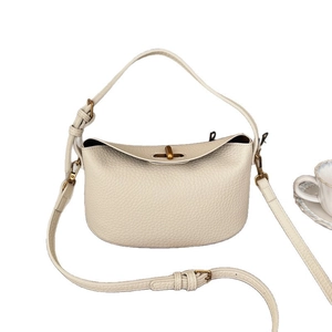 Chic off-white lychee grain leather handbag with gold twist lock and crossbody strap