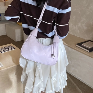 Detail of light purple crescent shoulder bag with smooth texture and metal buckle