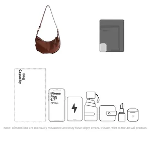 Detailed internal capacity showing dark brown leather hobo bag holding a 6.7-inch phone