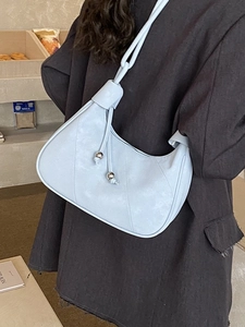 Minimalist light blue hobo underarm bag with knot strap and metallic charm for women
