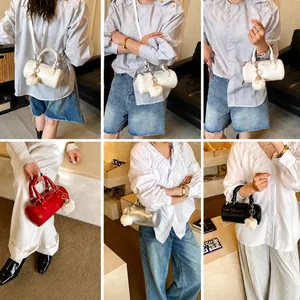 Detailed view of boston bags in white, red, silver, and black with cute bear charms