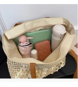 Top view of spacious straw tote bag interior showing zipper closure and large capacity