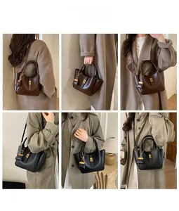 Minimalist bucket bag in black and brown with golden hardware shown in street style looks