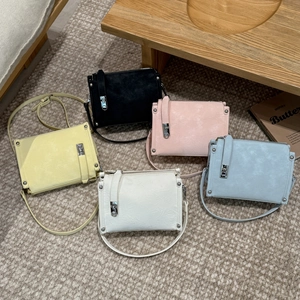 Detailed view of luxury pillow bags in five pastel colors with soft pleated leather textures