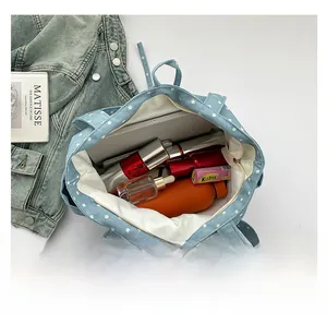 Top view of spacious star-patterned tote bag interior filled with daily items