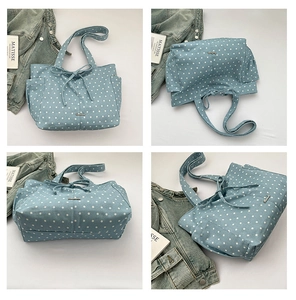 Detailed views of light blue polka dot tote bag with star prints and bow decoration